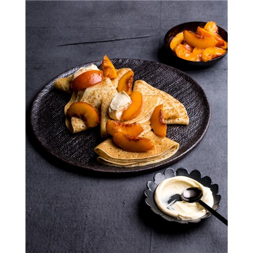 crepes with double cream and caramelised peaches